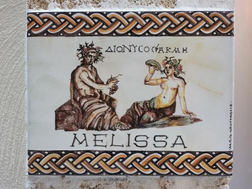 a sign for a museum with a man and a woman at DIONISO Bed & Wellness in Taranto
