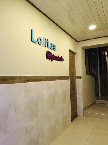 a sign for the lobby of a louisiana hospital at Lolitas Alojamiento Quillacollo in Cochabamba