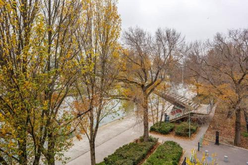 an overhead view of a park with trees and a staircase at Canalisez-vous au Bord du Canal in Aubervilliers