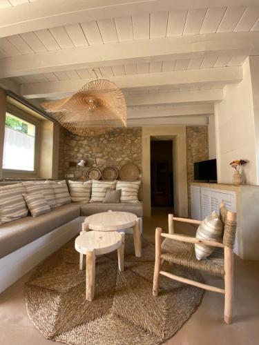 a living room with a couch and a table at Mas Ferran Adults Only in Pals