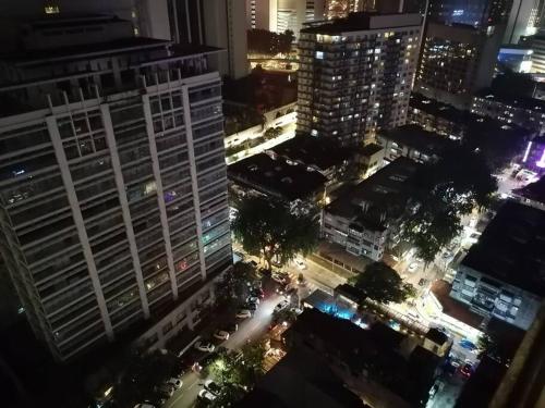 an aerial view of a city at night at One Bukit Ceylon Hosted by TCL Home 9062 in Kuala Lumpur