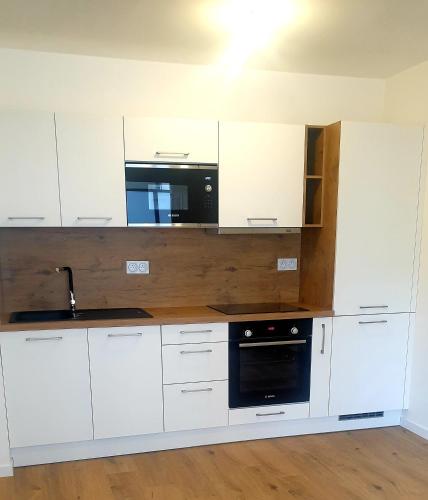 Photo de la galerie de l'établissement 2P Neuf & Confortable - Parking privé - 300m de la gare, à Le Plessis-Bouchard