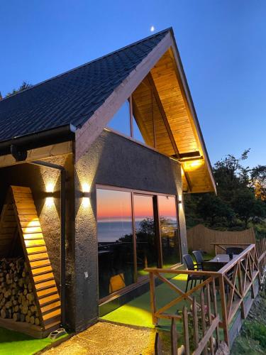 a house with a view of the sunset at Lavinya Suit Bungalov in Rize