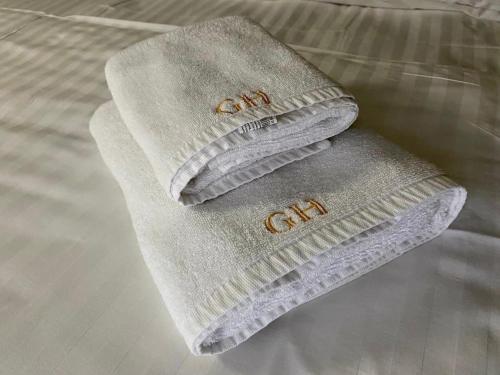 two towels sitting on top of a bed at Сонячна Квітка in Polyana