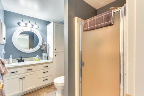 a bathroom with a toilet and a mirror at Charming Eugene Home with Fire Pit 8 Mi to UO! in Eugene