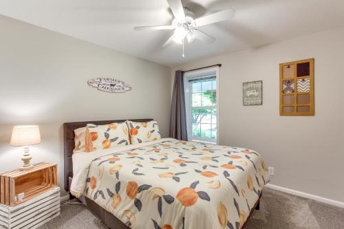 a bedroom with a bed and a ceiling fan at Charming Eugene Home with Fire Pit 8 Mi to UO! in Eugene