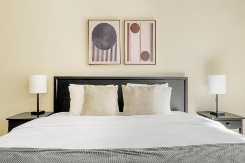 a bedroom with a large white bed with two lamps at San Bruno 2br w pool spa gym nr groceries SFO-1398 in San Bruno