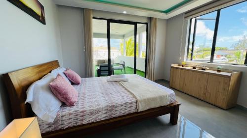 Postel nebo postele na pokoji v ubytování Blissful Villa