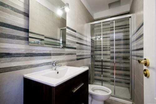 a bathroom with a sink and a toilet at Tamaragua Tenerife South Beach Bungalows in Arona