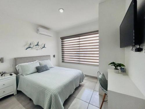Katil atau katil-katil dalam bilik di Portovera B, hermoso depa ideal para familias