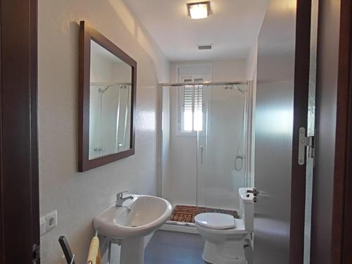 a bathroom with a sink and a toilet and a shower at CASA ROSAL in Cañada Rosal