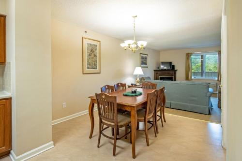 a dining room with a table and chairs at Massanuttens Shenandoah Villas by TripForth in McGaheysville