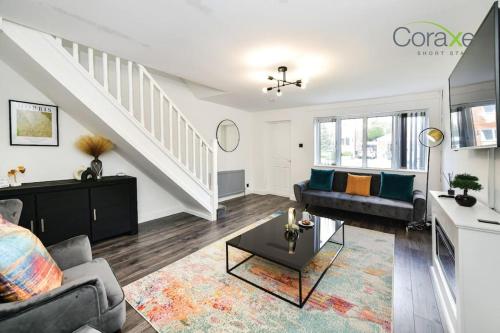 a living room with a couch and a table at 3 Bedrooms Urban Oasis for Contractors and Families by Coraxe Short Stays in Oldbury