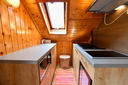 a kitchen with a sink and a stove at Guest House Martin in Korana