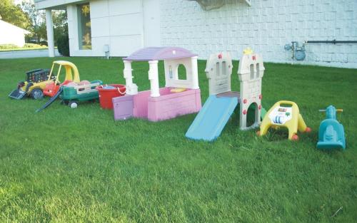 a group of toys in the grass in a yard at Harmony Inn in Goderich
