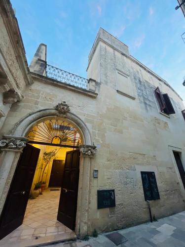 an entrance to a building with an open door at Victoria Apt - Historical Centre Lecce in Lecce