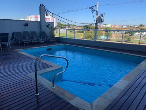 a swimming pool on the roof of a building at Cantinho do Ceu in Cachoeira Paulista