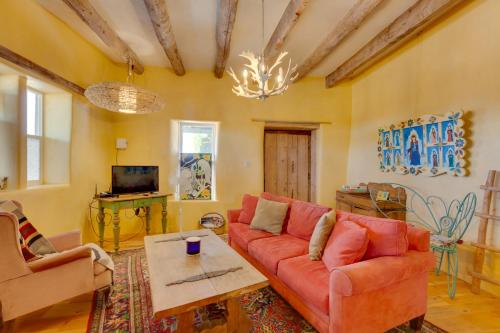 a living room with a couch and a table at Santa Cruz Home with Mountain Views! in Santa Cruz