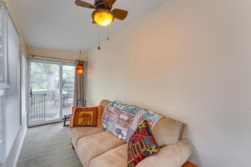 a living room with a couch and a ceiling fan at Pet-Friendly Home with Views of Lake Delavan! in Delavan