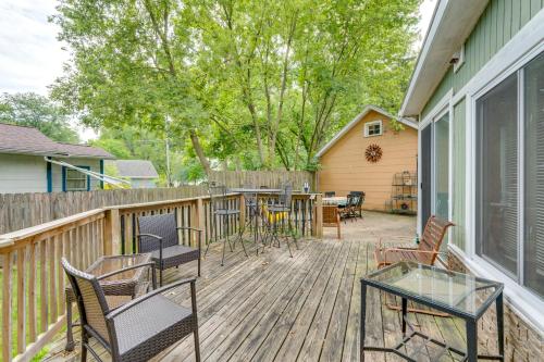 a deck with chairs and tables and a table at Pet-Friendly Home with Views of Lake Delavan! in Delavan
