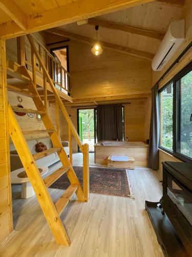 a room with bunk beds in a tiny house at IVA House in Çamlıhemşin