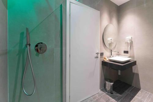 a bathroom with a shower and a sink at ML luxury room in Lido di Spina