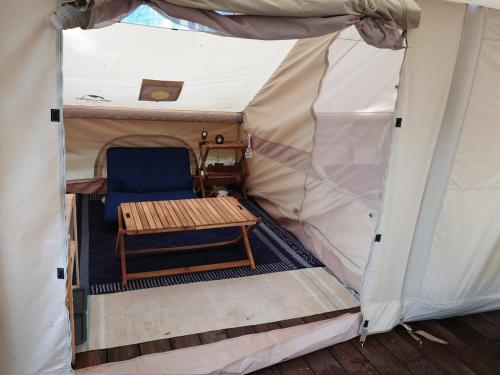 a tent with a chair and a table in it at Minamiaso STAYHAPPY - Vacation STAY 28491v in Shimoda