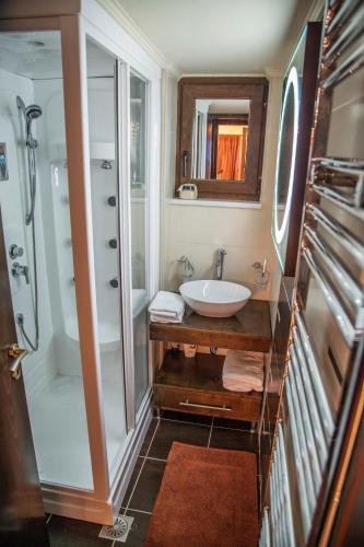 a bathroom with a sink and a shower at Villa Veghera in Kissamos