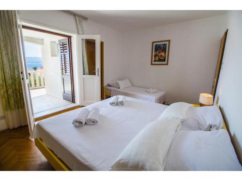 Postel nebo postele na pokoji v ubytování Bol Residence