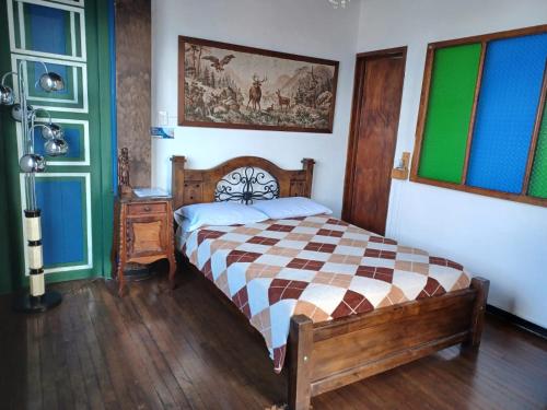 Postel nebo postele na pokoji v ubytování Hostal Mirador Andino
