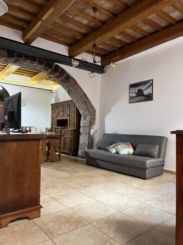 a living room with a couch and a table at casa centro storico in Montefiascone