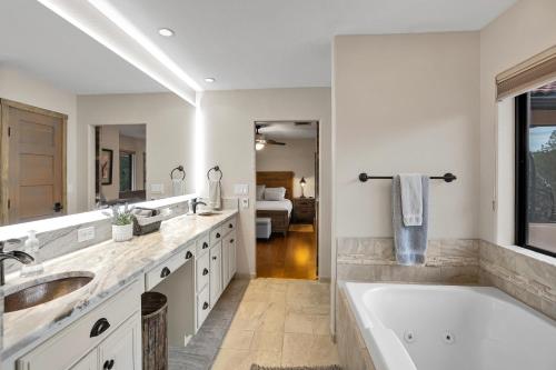 a bathroom with two sinks and a bath tub at Sedona's Paradise Found, Saltwater Pool and Hot Tub, Private Oasis! in Sedona