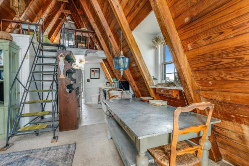 a home office with a desk and a ladder at Anchor's Holding in Holden Beach