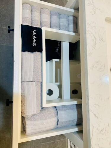 a towel rack with towels in a bathroom at Cozy New Mfd Home near Lake Norman in Denver