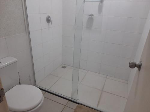 a bathroom with a shower with a toilet at Aldeia das Aguas Village in Barra do Piraí