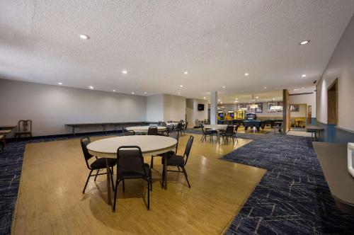 a large room with a table and chairs in it at Quality Inn & Suites Canon City in Canon City