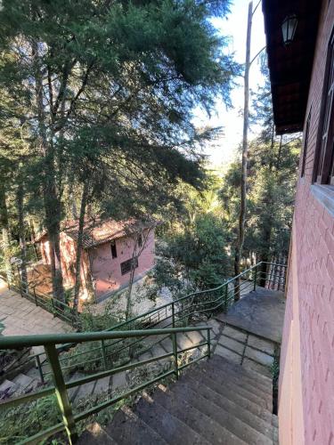 a set of stairs leading up to a house at Recanto dos Sonhos Guest House in Lumiar