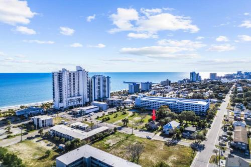 an aerial view of a city and the ocean at Dazzling Centrally Located Ocean View w 2 Kings, Huge Private Yard, 2 Decks, Firepit, BBQ in Myrtle Beach