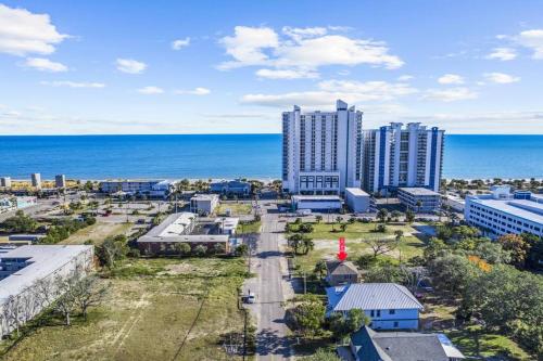 an aerial view of a city and the ocean at Dazzling Centrally Located Ocean View w 2 Kings, Huge Private Yard, 2 Decks, Firepit, BBQ in Myrtle Beach