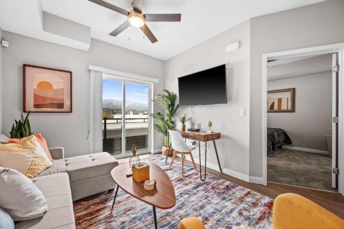 a living room with a couch and a table at City View BOHO Apt Stocked w everything you need in Salt Lake City
