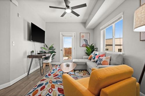 a living room with a couch and a table at Charming Downtown Getaway in Salt Lake City