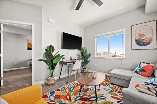 a living room with a couch and a table at Central City Escape in Salt Lake City
