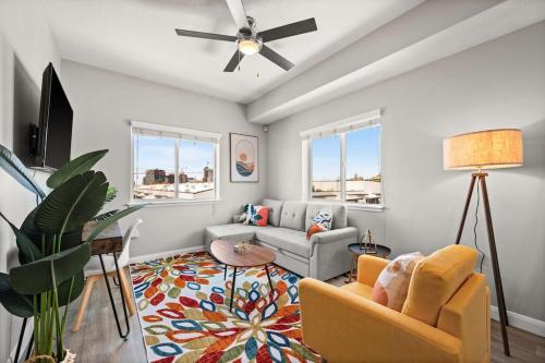 a living room with a couch and a ceiling fan at Central City Escape in Salt Lake City