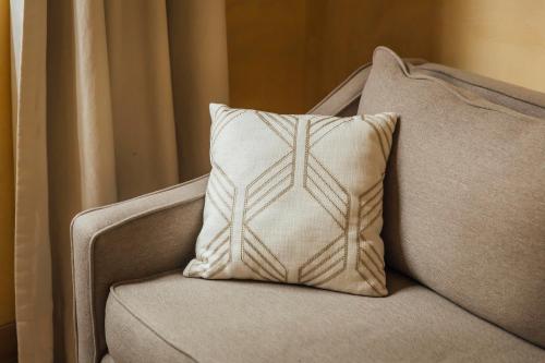 a pillow sitting on top of a couch at Maison du comte in Mexico City