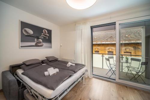 Posteľ alebo postele v izbe v ubytovaní Grace Pine Apartment 2