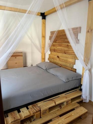 a bedroom with a bed in a tent at Appartamento Cassandra in Seregno