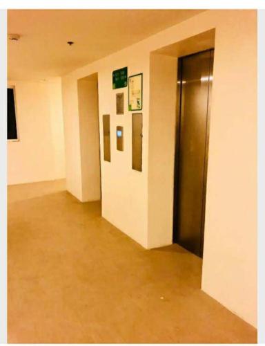an empty hallway with a elevator in a building at Amaia Steps Condominium Studio -across Ayala Mall Capitol Central in Bacolod