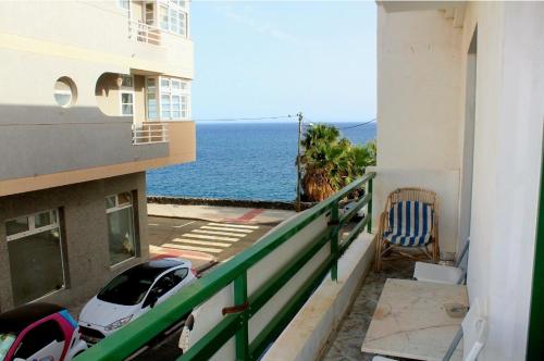 a balcony with a view of the ocean from a building at Terrazas del Sur in Los Abrigos