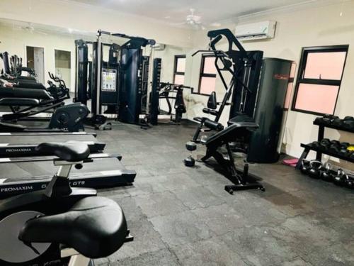a gym with several treadmills and exercise bikes at FlowerPot by the Sea in Lucea
