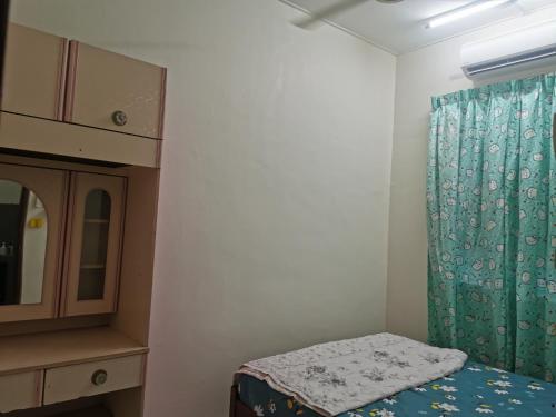 Postel nebo postele na pokoji v ubytování Homestay Taman Mas, Kg Koh
